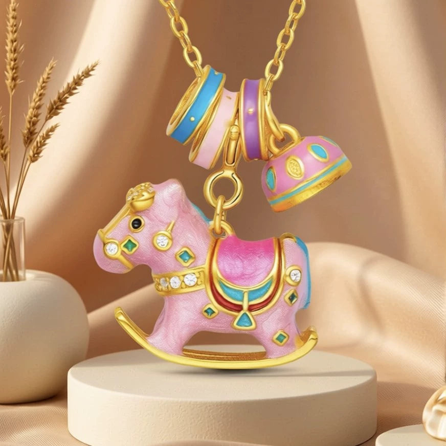 Enamel rocking horse necklace with gold chain, pink horse charm and purple striped teacup