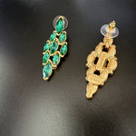 Green marquise rhinestone earrings with gold-tone backs on stud posts