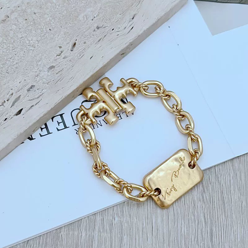 Gold rectangular tag chunky chain bracelet with entwined H links