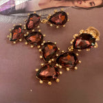 Cactus-cut sparkling glass diamond ear clips in dark red with gold-tone settings