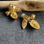 Gold-tone clip-on earring back with strawberry and flower enamel detail, faux pearls.