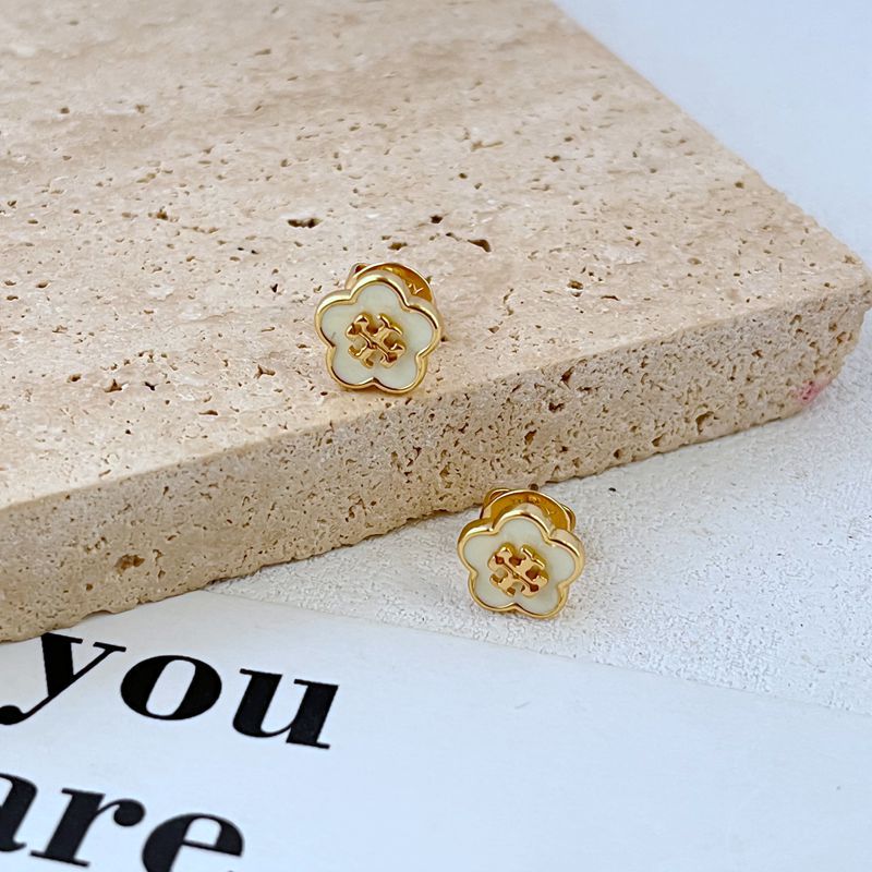 Enamel flower stud earrings, gold-tone with white petals and red motif