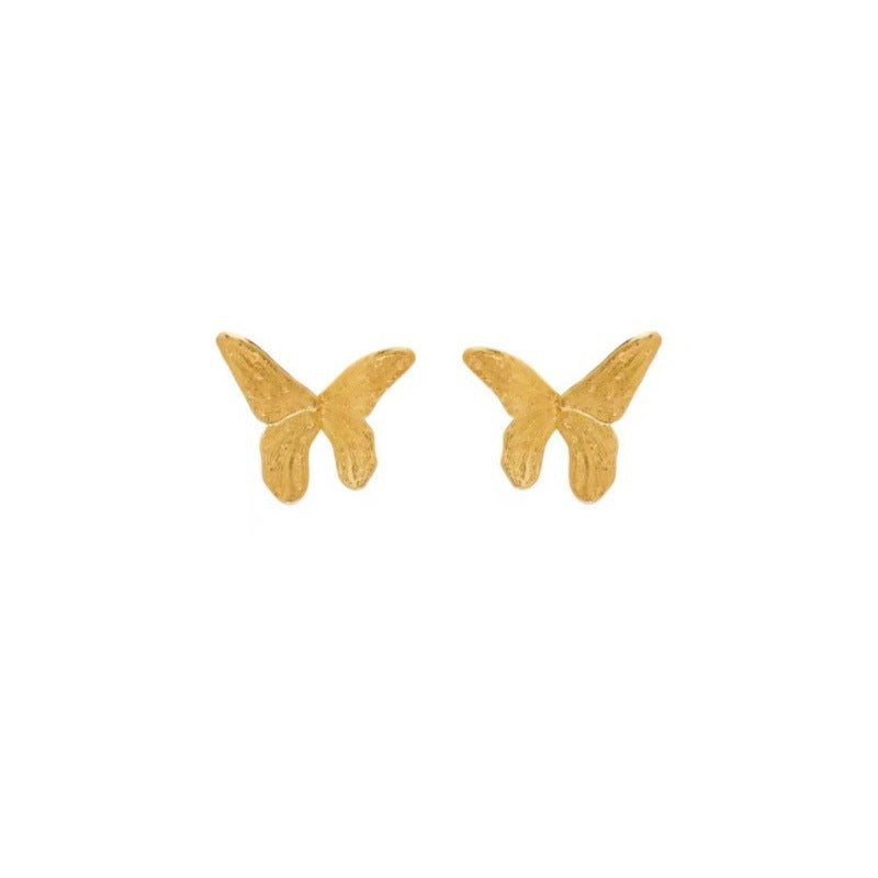 Pair of small gold butterfly stud earrings, symmetrical front view