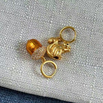 Gold-tone squirrel and acorn charm earrings with hoop loops and sparkle details