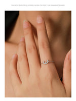 Silver adjustable chain ring on finger with Arabic letter pavé charm and bead ends