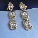 White crystal long drop clip-on earrings with three oval stones in gold-tone settings