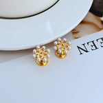 Gold-tone pearl openwork metal stud earrings, crown-style setting with white pearls