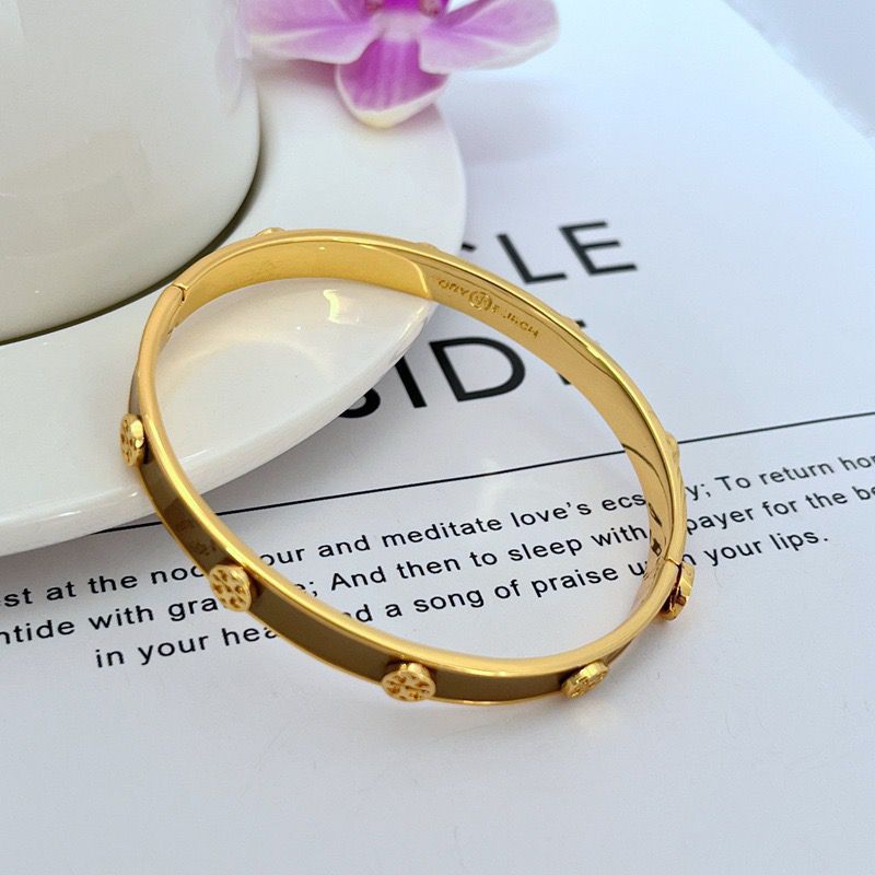 Goldfarbenes Metallarmband mit Logo-Emaille und runden Kugel-Detailpunkten