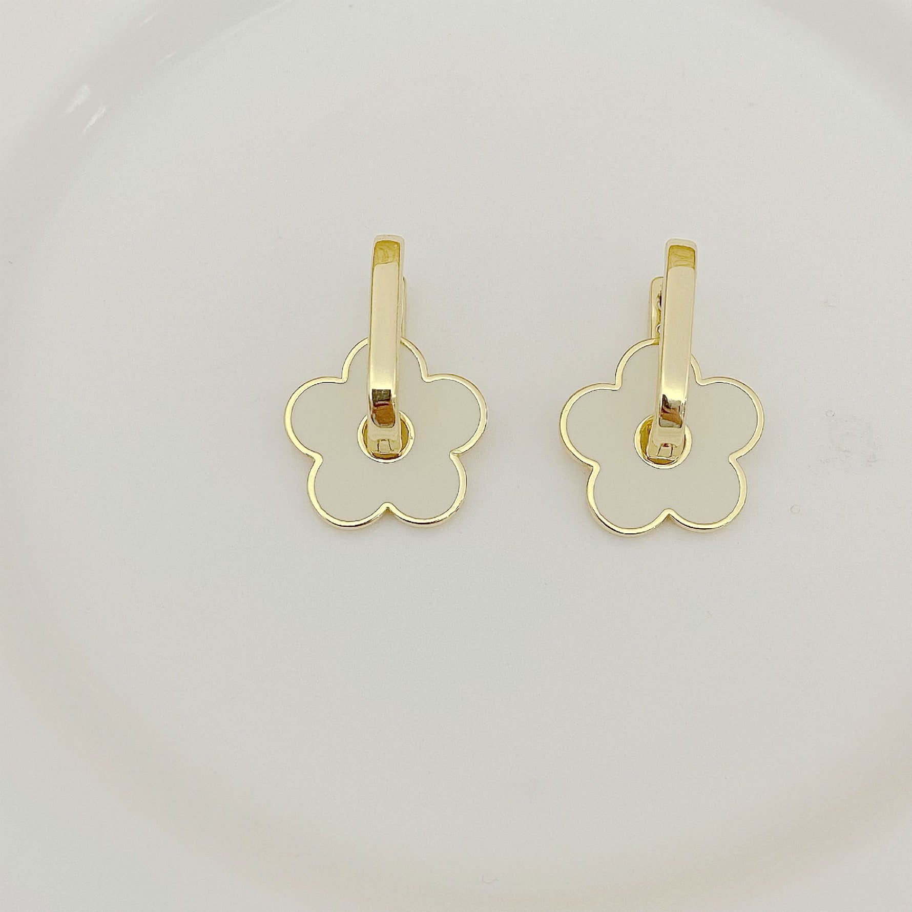 Tory Burch gold-tone floral logo U-shaped metal earrings with dangling bar detail
