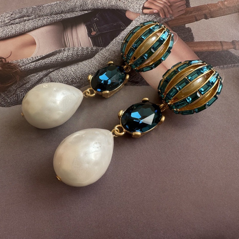 Pearl drop crystal earrings with blue oval stones and gold-tone hoop settings