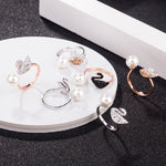 Swan pearl open ring set with white pearls, black and rose-gold swan details, crystal pavé
