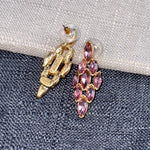 Rose pink marquise rhinestone earrings with gold-tone backs and stud posts