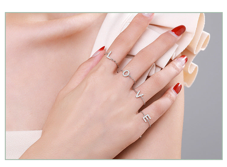 Sterling silver adjustable pavé initial ring with an outlined letter design