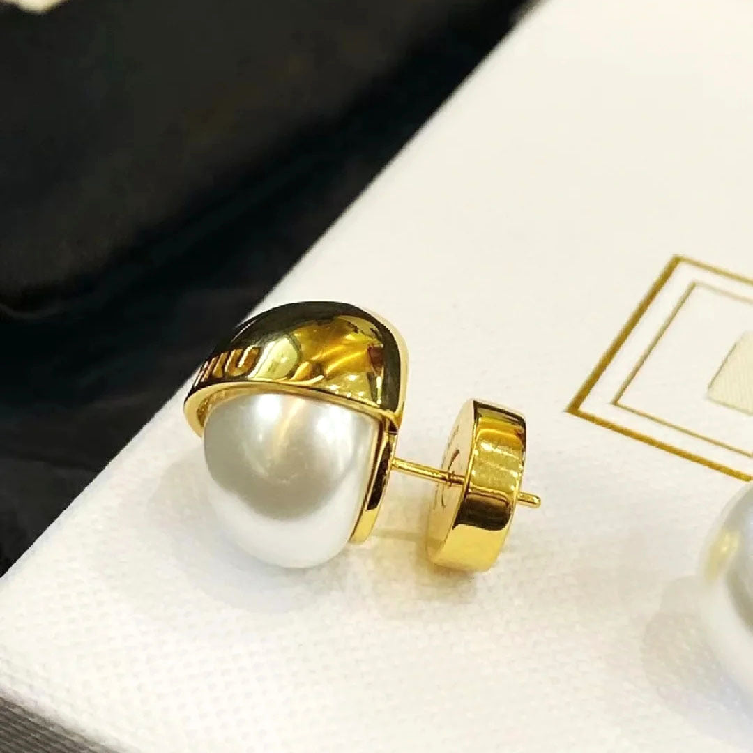 White pearl stud earrings with gold-tone outer shell and post back