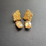 Gold-tone crystal drop earrings with oval golden stones