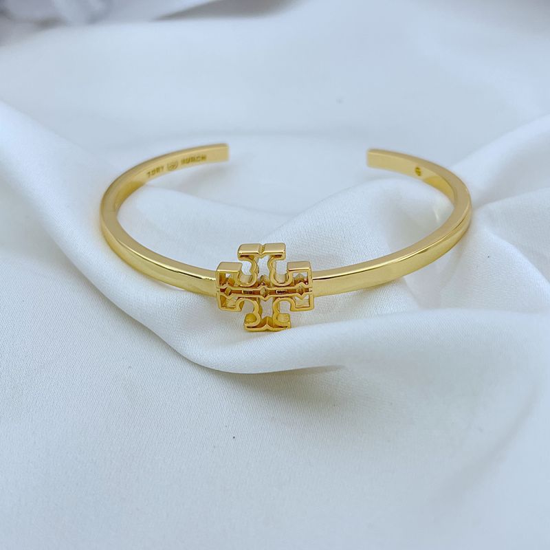 Gold openwork square logo smooth cuff bangle, front view