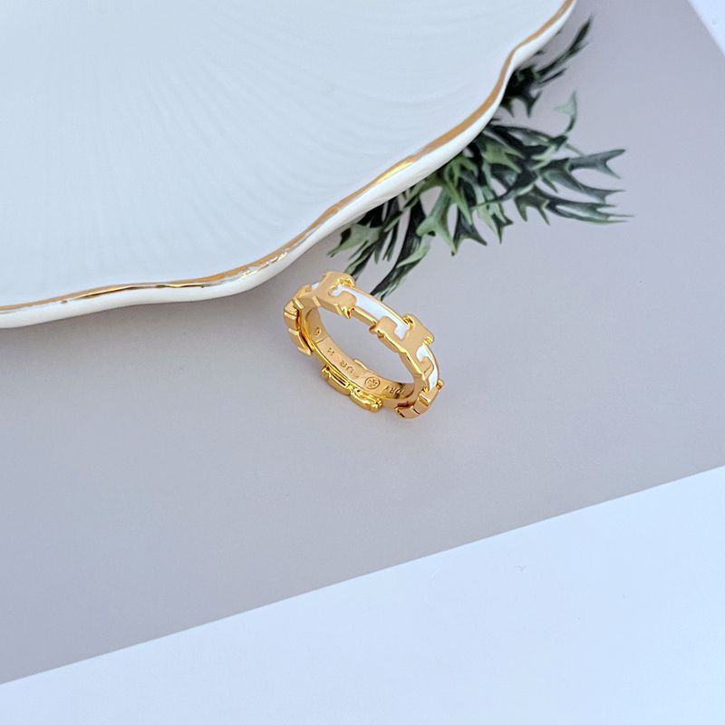 Enamel geometric circle ring, gold-tone metal band with dark enamel accents