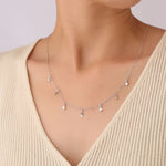 Silver-tone S925 teardrop zircon station necklace with small dangling round stones