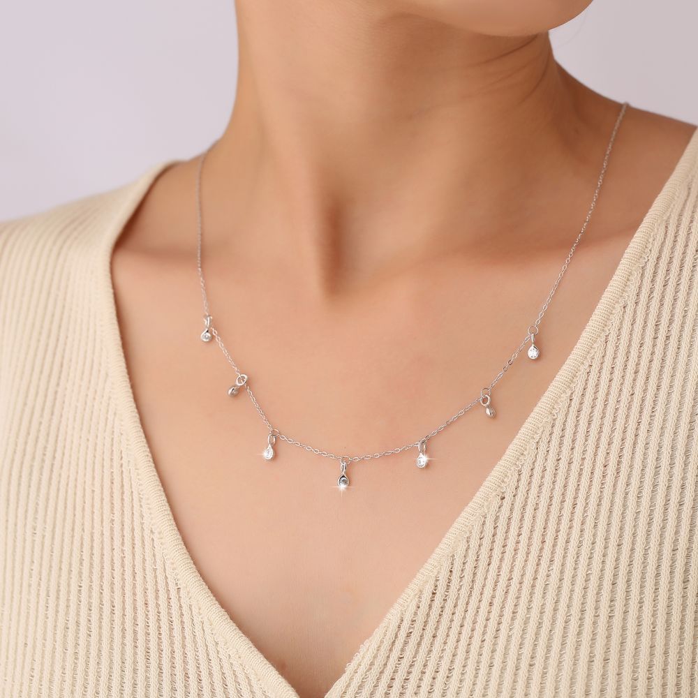 Silver-tone S925 teardrop zircon station necklace with small dangling round stones