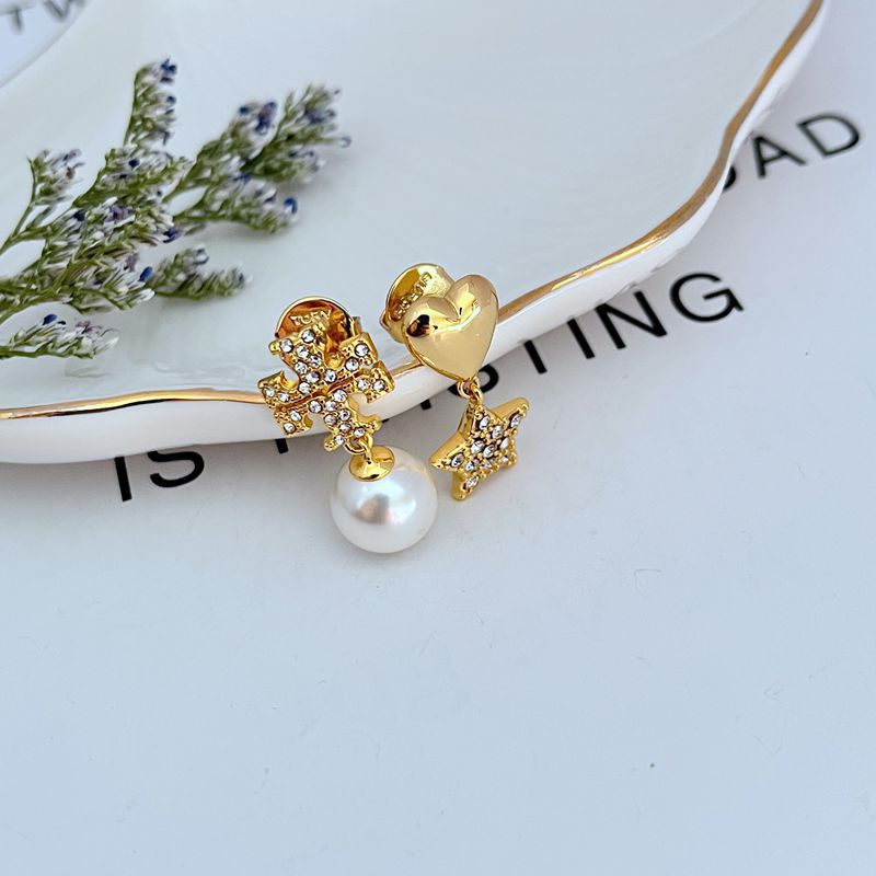 Gold drop earrings with asymmetrical heart and star charms, rhinestone sparkle and pearl