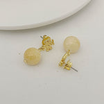 Light yellow agate pendant earrings with gold logo stud and round bead drop