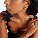 Gold-tone heart stud earrings with cutout openwork and round clear crystals
