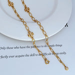 Interlocking logo charm necklace, gold-tone oval links with clover centerpiece charms
