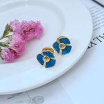 Enamel Camellia stud earrings, dark blue flower with gold-tone center