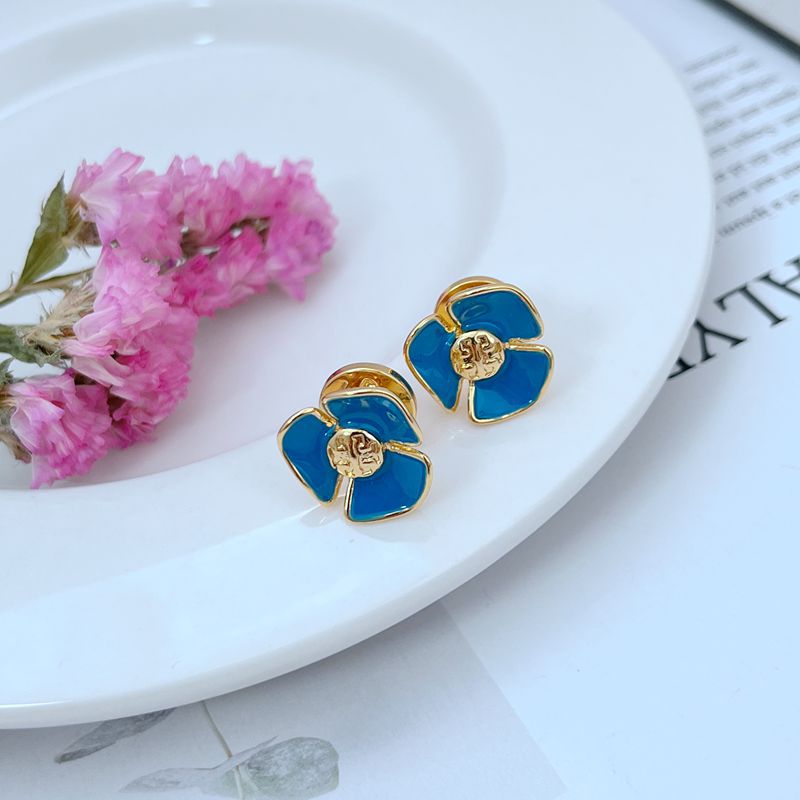 Enamel Camellia stud earrings, dark blue flower with gold-tone center