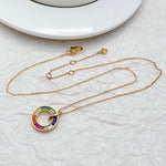 Gold-tone zircon donut pendant necklace with rainbow multicolor rings on chain
