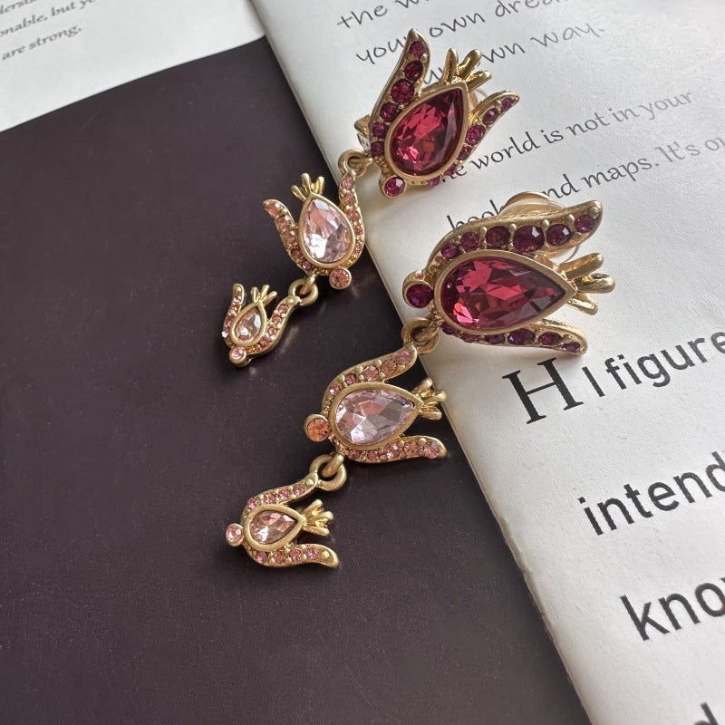 Gold-tone floral zircon drop earrings with rose-pink teardrop stones
