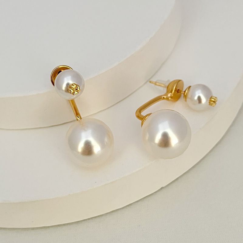 Gold-tone curved pearl drop earrings with large and small white pearls