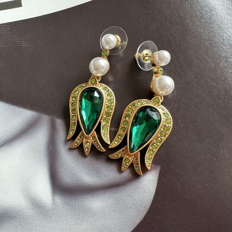 Gold-tone tulip earrings with dark green pear crystal, green accents, and pearl dangles