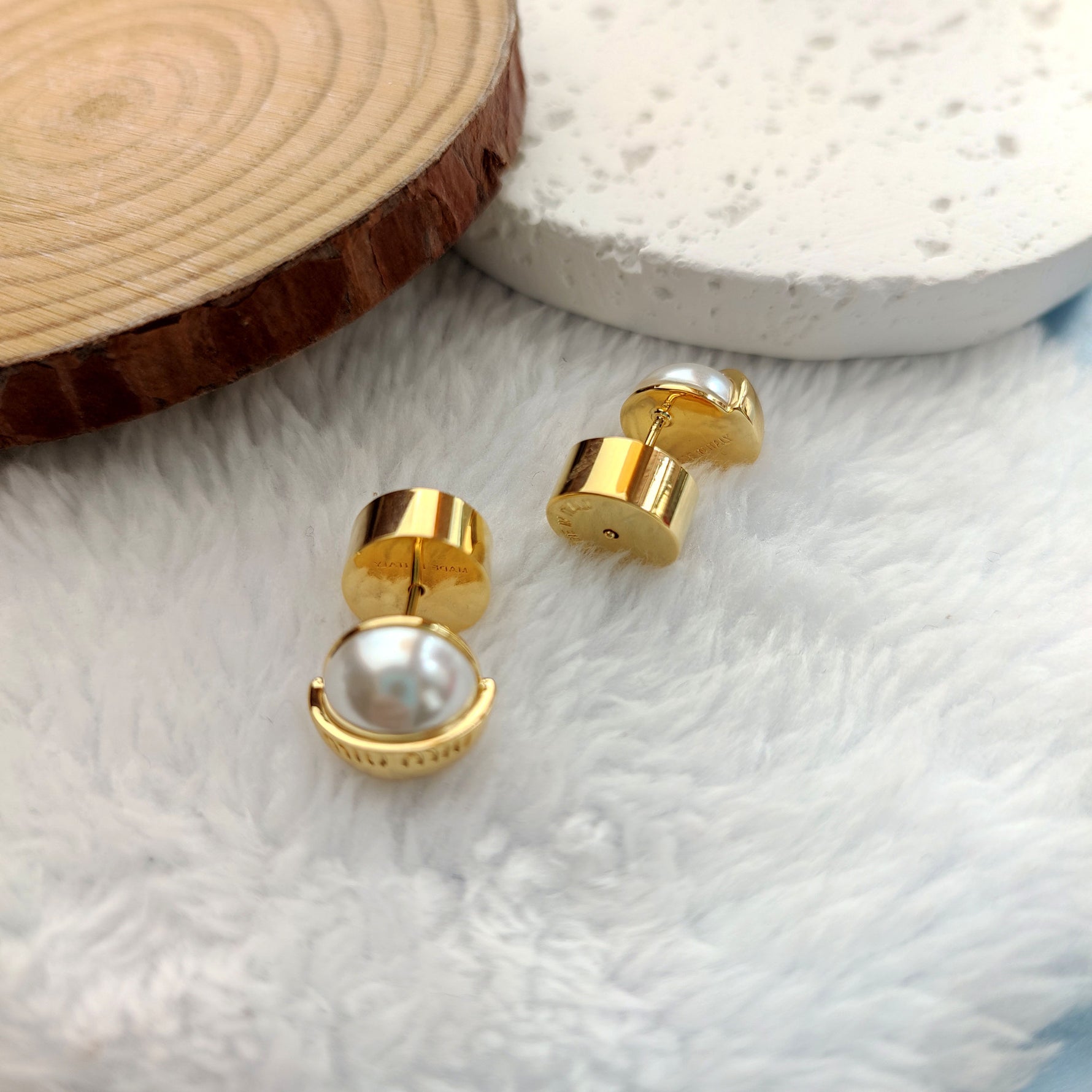 Gold-tone stud earrings with sweet pearl inserts in round hinged settings