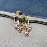 Long enamel flower hoop drop stud earrings with pink petals and gold details