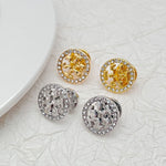 Pair of round logo stud earrings: gold-tone and white-gold tone, rhinestone outer rim