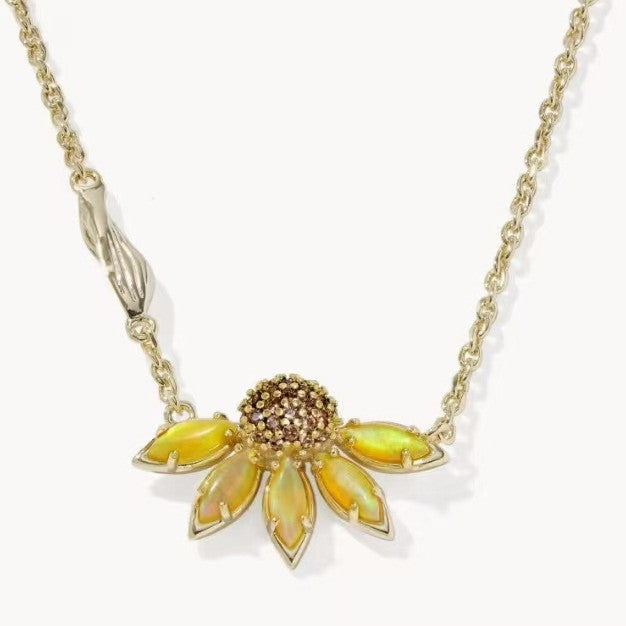 Gold-tone daisy flower pendant necklace with yellow petals and rhinestone center