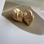 White enamel ice-cream stud earring with gold-tone backing and sparkling rhinestone detail