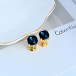 Geometric square stud earrings with dark blue rhinestones and gold-tone posts