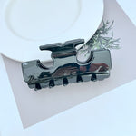 T-shaped shark hair clip in dark glossy black