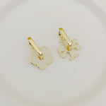 Tory Burch gold-tone logo U-shaped metal earrings with floral and puzzle cutouts