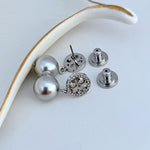 Pearl drop earrings with round logo disc and butterfly back clasps