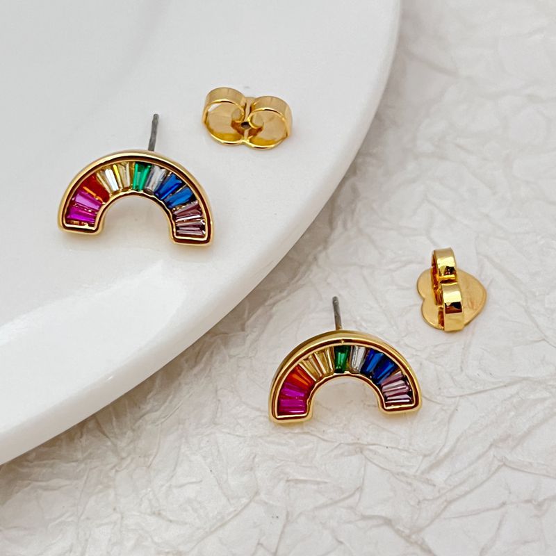 Rainbow zircon arch earrings and gold-tone stud backs with multicolor stone details