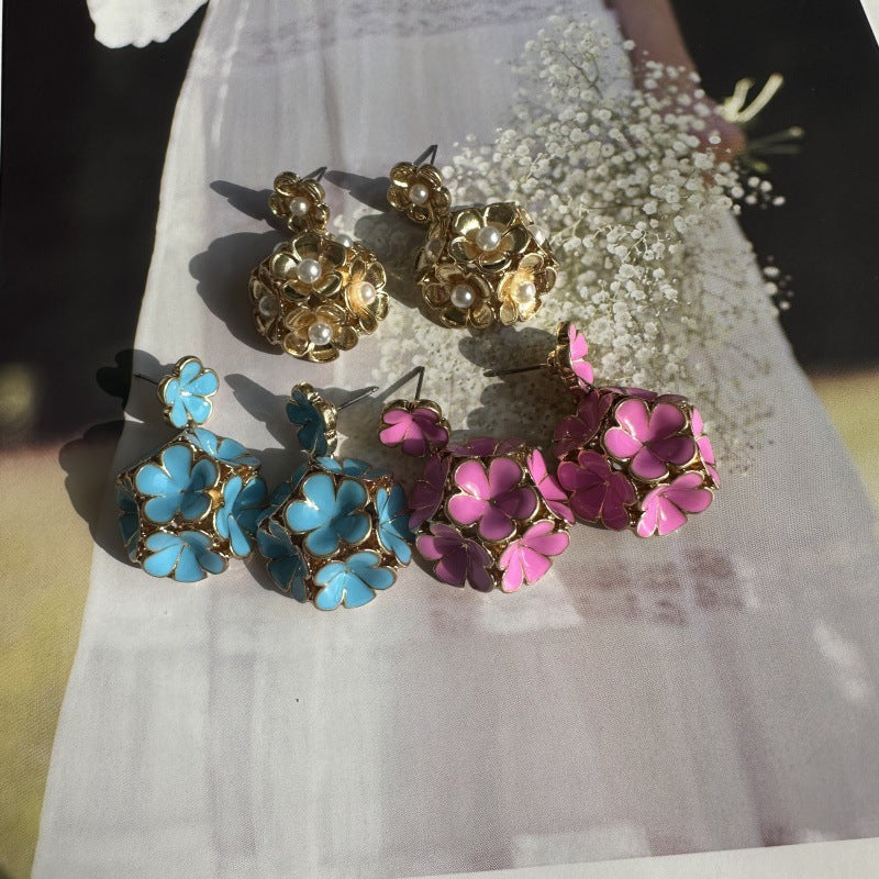 Assorted enamel floral earrings: gold-tone pearl, blue and pink/purple flowers