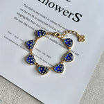 Blue matte heart bracelet, gold-tone chain with heart charms