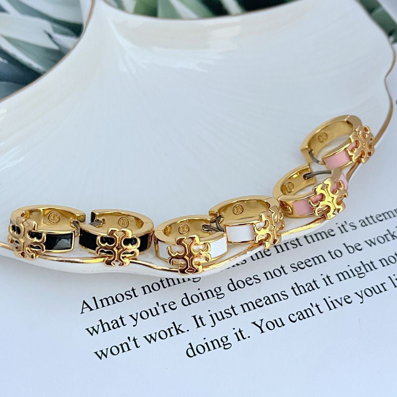 Enamel logo metal earrings, pink square inlay, gold-tone hoops