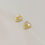 Heart-shaped mother-of-pearl metal stud earrings, gold-tone