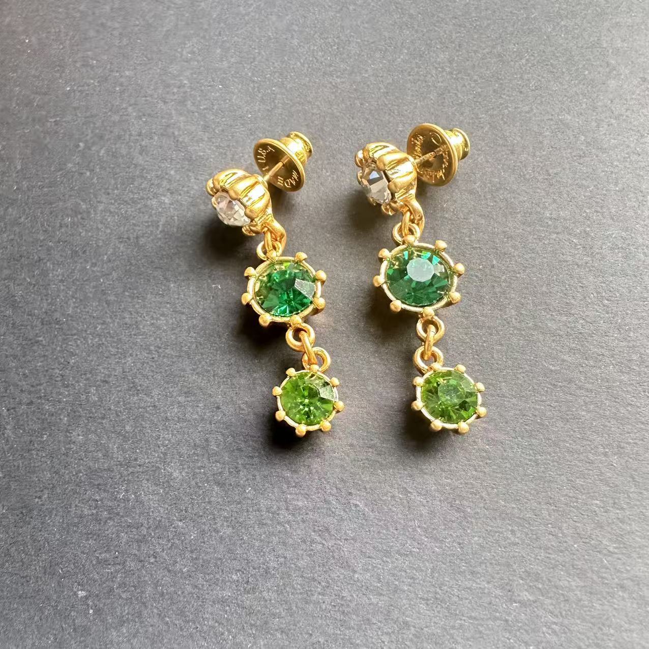 Gold-tone round crystal drop earrings with dark green and light green dangling stones