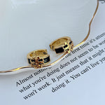 Enamel logo metal earrings, black square inlay, gold-tone hoops