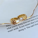 Enamel logo metal earrings, white square inlay, gold-tone hoops